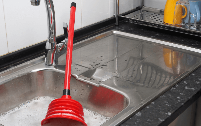 Water draining slowly is a sign that your drains need unblocking